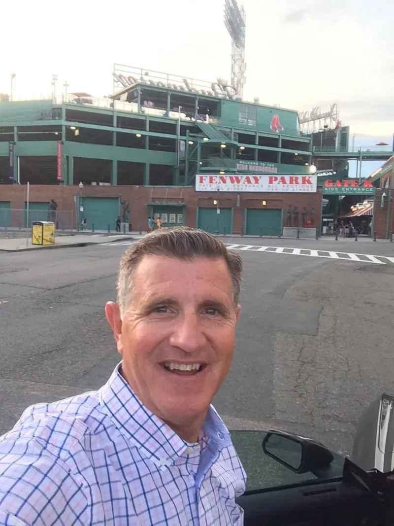 Michael Magic Morgan smiling outside Fenway Park